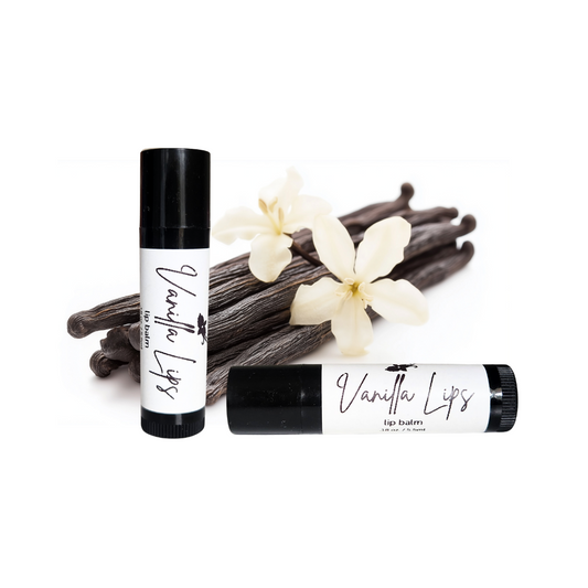 Vanilla Lift rollerball with vanilla beans and flowers on a white background